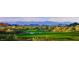 Expansive golf course with mountain views, illustrating the scenic beauty and recreational opportunities at 40858 N 109Th Pl, Scottsdale, AZ 85262