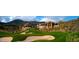 A lush green golf course is nestled in a desert landscape in this picturesque desert community at 40858 N 109Th Pl, Scottsdale, AZ 85262