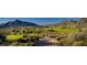 A picturesque golf course view with mountains in the background at 40858 N 109Th Pl, Scottsdale, AZ 85262