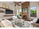 Spacious living room featuring a stone fireplace and comfortable seating at 40858 N 109Th Pl, Scottsdale, AZ 85262