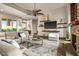 Bright living room with stylish furnishings, a large window, and a ceiling fan at 40858 N 109Th Pl, Scottsdale, AZ 85262
