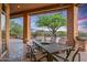 Outdoor patio with table and chairs, ideal for al fresco dining at 40858 N 109Th Pl, Scottsdale, AZ 85262