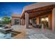 Exterior view of a house featuring a large covered patio and pool at 40858 N 109Th Pl, Scottsdale, AZ 85262