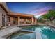 Back of house and pool at dusk, showing outdoor living space at 40858 N 109Th Pl, Scottsdale, AZ 85262