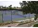 Tennis courts with players, showcasing the community's active lifestyle and recreational amenities at 40858 N 109Th Pl, Scottsdale, AZ 85262