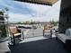Relax on this sunny balcony with comfortable seating and a view of the street at 425 S Parkcrest -- # 323, Mesa, AZ 85206