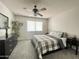 Comfortable bedroom featuring ceiling fan, plush carpet and ample natural light at 425 S Parkcrest -- # 323, Mesa, AZ 85206