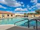 Beautiful community pool area with lounge chairs and clear blue water, perfect for relaxation and recreation at 425 S Parkcrest -- # 323, Mesa, AZ 85206