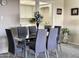 Dining area with glass table and seating for six, open to the updated kitchen at 425 S Parkcrest -- # 323, Mesa, AZ 85206