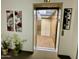 View of the interior of the elevator with interior lighting, neutral walls and adjacent decorations at 425 S Parkcrest -- # 323, Mesa, AZ 85206