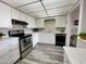 Bright kitchen with sleek appliances, ample counter space, and wood-look floors at 425 S Parkcrest -- # 323, Mesa, AZ 85206