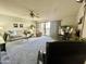 Spacious living room with ceiling fan and sliding glass doors to the outside balcony at 425 S Parkcrest -- # 323, Mesa, AZ 85206