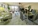 Open concept living area with plush carpet and sliding glass doors to the outside at 425 S Parkcrest -- # 323, Mesa, AZ 85206