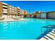 This community features a pool and lounge chairs for residents to enjoy on a hot day at 425 S Parkcrest -- # 323, Mesa, AZ 85206
