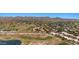 Panoramic aerial shot highlighting the homes with red tile roofs, and a beautiful green golf course for an active lifestyle at 4346 E Bannock St, Phoenix, AZ 85044