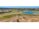 Scenic aerial view of the golf course with a serene lake and lush green surroundings, perfect for outdoor recreation and relaxation at 4346 E Bannock St, Phoenix, AZ 85044