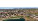 A scenic aerial view capturing a golf course, community amenities, and residential area with red tile roofs nestled amidst green landscapes at 4346 E Bannock St, Phoenix, AZ 85044