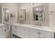 Bathroom with double sinks, modern fixtures, and large mirrors at 4346 E Bannock St, Phoenix, AZ 85044