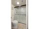 Bathroom features a glass shower door with a modern design and a standard toilet at 4346 E Bannock St, Phoenix, AZ 85044