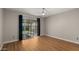 Bedroom featuring wood flooring and a sliding glass door to the backyard at 4346 E Bannock St, Phoenix, AZ 85044