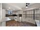 The well-lit kitchen features stylish tiled floors and a cozy eating nook with a ceiling fan at 4346 E Bannock St, Phoenix, AZ 85044
