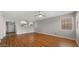 Bright living room featuring wood flooring and arched doorways to the kitchen at 4346 E Bannock St, Phoenix, AZ 85044