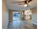 Open-concept living space with modern flooring, slider door, and white cabinets in the kitchen at 5222 N 41St Ave, Phoenix, AZ 85019