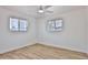 Bright bedroom showcasing a ceiling fan and ample natural light at 5510 E Dallas St, Mesa, AZ 85205