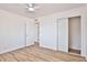 Bright bedroom featuring a ceiling fan and a closet with sliding doors at 5510 E Dallas St, Mesa, AZ 85205
