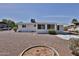 Rear exterior view showcasing well-maintained yard and architectural details at 5510 E Dallas St, Mesa, AZ 85205