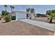 Inviting single-story home with desert landscaping, a spacious driveway, and a tidy facade at 5510 E Dallas St, Mesa, AZ 85205