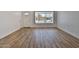 Spacious living room boasting stylish flooring, a large window, and a welcoming atmosphere at 5510 E Dallas St, Mesa, AZ 85205
