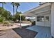 Covered patio area featuring desert landscaping, enhancing the outdoor living space at 5510 E Dallas St, Mesa, AZ 85205