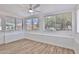 Sun room filled with windows offering views of the landscaped exterior at 5510 E Dallas St, Mesa, AZ 85205