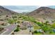 Captivating aerial perspective featuring a swimming pool and meticulously maintained landscaping in a serene setting at 5812 W Spur Dr, Phoenix, AZ 85083