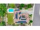 Aerial view of home with solar panels, swimming pool, manicured lawn and paved driveway at 5812 W Spur Dr, Phoenix, AZ 85083