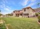 Expansive backyard featuring well-maintained lawn perfect for activities and relaxation with desert views at 5812 W Spur Dr, Phoenix, AZ 85083