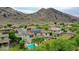 Beautifully landscaped backyard with a sparkling pool, offering a private retreat with lush green surroundings at 5812 W Spur Dr, Phoenix, AZ 85083