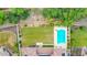 Aerial view of a private backyard featuring a pool, lush green lawn, and mature landscaping at 5812 W Spur Dr, Phoenix, AZ 85083