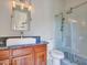 Bathroom showcasing elegant vanity, undermount sink, modern fixtures, and tiled glass shower at 5812 W Spur Dr, Phoenix, AZ 85083