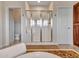 Bathroom features large glass shower with white tile and door to separate toilet room at 5812 W Spur Dr, Phoenix, AZ 85083