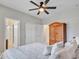 Comfortable bedroom featuring a ceiling fan and a large closet, creating a relaxing retreat at 5812 W Spur Dr, Phoenix, AZ 85083