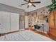 Bedroom features light fixture, desk, and large closet for storage and organization at 5812 W Spur Dr, Phoenix, AZ 85083