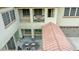 Aerial view of an outdoor courtyard seating area beneath a balcony with stone pillars at 5812 W Spur Dr, Phoenix, AZ 85083