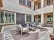 Cozy courtyard with modern outdoor furniture, a fireplace, and a stylish rug at 5812 W Spur Dr, Phoenix, AZ 85083