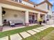 Spacious covered patio is perfect for outdoor living, featuring comfortable seating, dining and desert views at 5812 W Spur Dr, Phoenix, AZ 85083