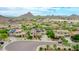 Striking exterior showcasing meticulous landscaping and solar panels, set against a backdrop of scenic mountain views at 5812 W Spur Dr, Phoenix, AZ 85083