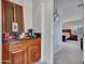 Hallway featuring a bar area, and view into the primary bedroom at 5812 W Spur Dr, Phoenix, AZ 85083