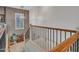 Upstairs hallway with wood railing and wrought iron balusters at 5812 W Spur Dr, Phoenix, AZ 85083