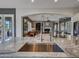 Kitchen sink overlooks a spacious living room with a stone fireplace at 5812 W Spur Dr, Phoenix, AZ 85083